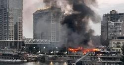 المختبر الجنائي يفحص الأدلة الجنائية في حريق بسفينة جسر في جامعة الجيزة
