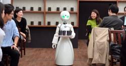 شباب يديرون مقهى من المنازل باستخدام روبوتات متطوره فى طوكيو صور