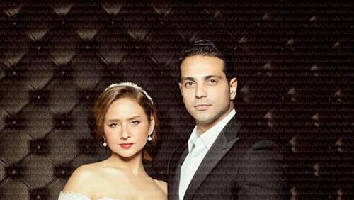 Nelly cream with a joy dress with Hisham Ashour before holding the Koran and wedding photos