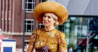 The Golden Queen Maxima Queen of the Netherlands is elegant in a bright dress