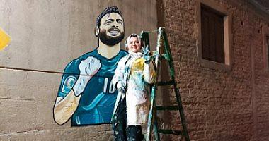 Nour Karamat Abu Jabal and Mohammed Salah Bajafeeti pictures on the walls of the streets of Marj