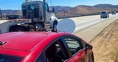 The arrest of a person who drives a car installed by an industrial dish for Starlink in California