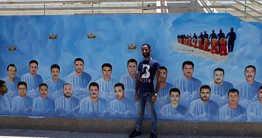 Samih creates the anniversary of the martyrs of Libya on a mural in the religion in our hearts