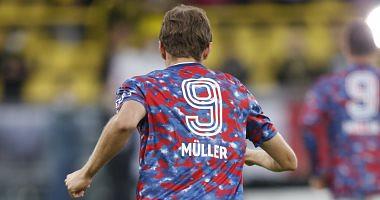 Bayern Munich players wearing a shirt with a name and a mix number