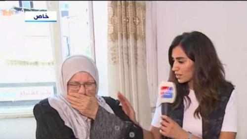 A woman from Gaza is crying during her talk about the Israeli shelling lost 14 video