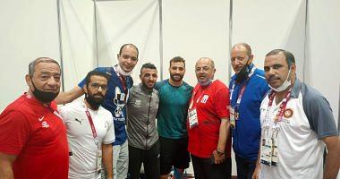 The Olympic president stimulates Mohamed Metwally and Kisho before half the final wrestling pictures