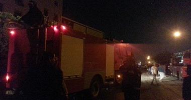 4 fire extinguishing cars are trying to control a fire behind the walls behind the Ministry of Agriculture in Dokki