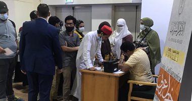 Draw your most attractive name with AlAzhar wing at the video book exhibition and photos