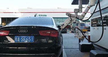 Robot charging cars in one of China stations