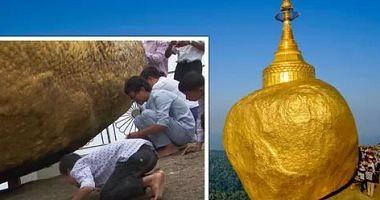 The temple of the golden rock is a religious shrine challenging gravity in Myanmar Photos