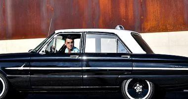 Joe Jonas in a classic car in Californias streets I know its kind