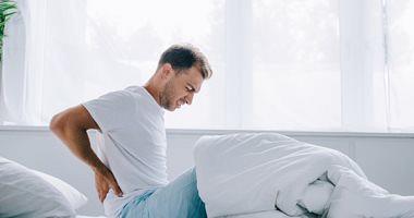 Signs shows that bed behind back pain