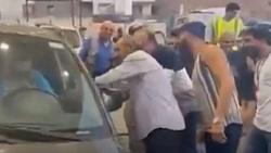 سبب أزمة الوقود رجل لبناني متنكّر بزي امرأة لتحفيز سيارته